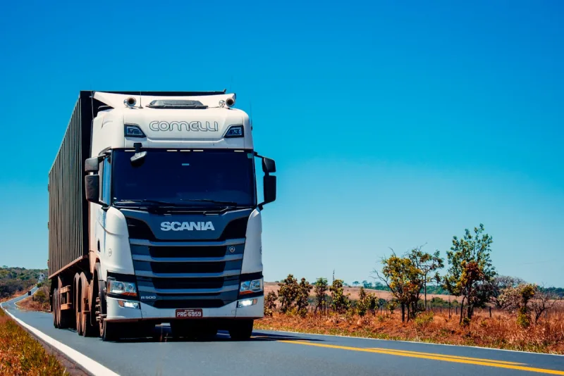 Commercial truck traveling along a rural highway